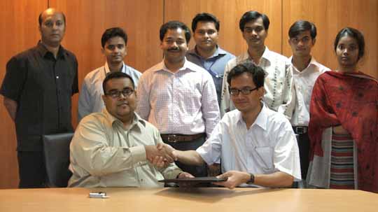 The official Agreement Signing Handshake between Citycell AVP Marketing (VAS) Mr. Ahmed Armaan Siddiqui and 3SM Systems representative Mr. Sujoy Kumar Chowdhury. Also present are Citycell officials (standing from left) Citycell AVP Engineering (VAS) Mr. Shamiul Haque, Mr. Abu Zaid Md. Hussain, Mr. Adnan Bin Taj and Mr. Shahrear Seraj. Right to them are 3SM members Mr. Hasan Shihab Uddin, Mr. Mahbubur Rahman and Ms. Nahid Mahfuza Alam.